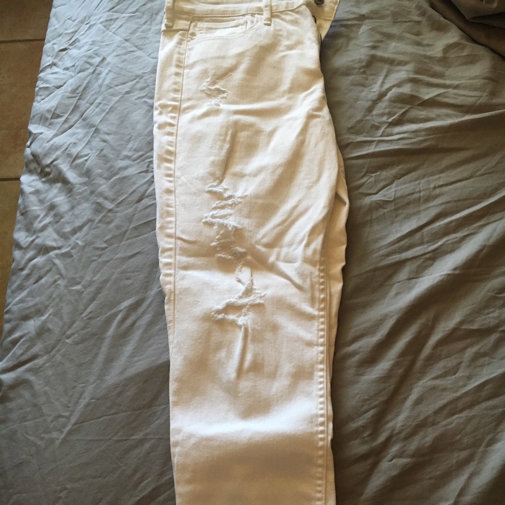 White ripped pants